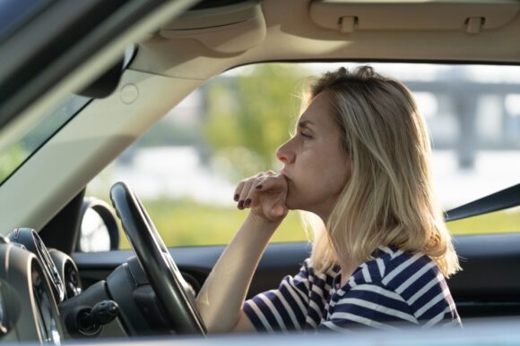 Woman contemplates whether she can sell her financed car online