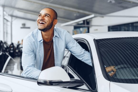 Man is excited to drive his new car