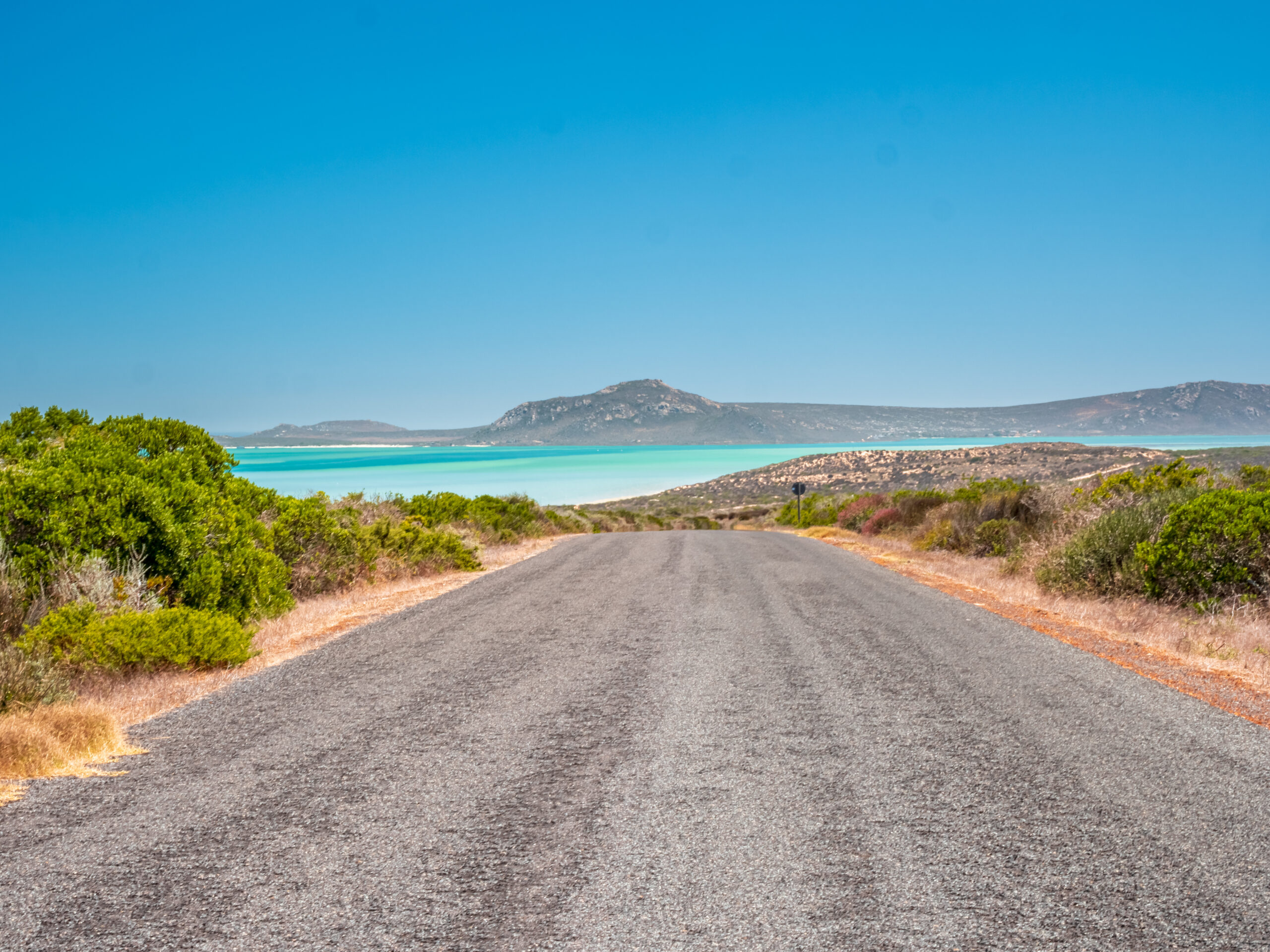 he long, open road leading to the turquoise waters of Langebaan on the West Coast, an ideal route for practicing skills learned during manual driving lessons.